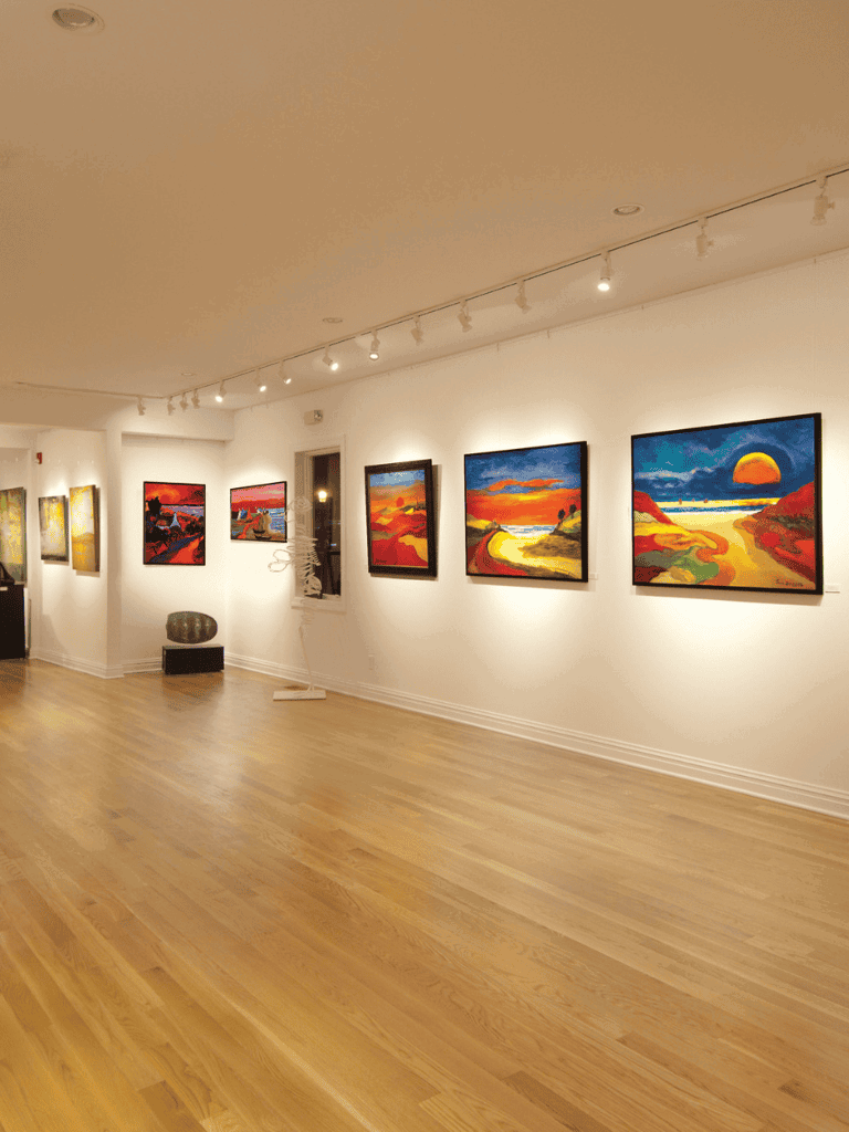Colorful landscape paintings displayed at QuestForDirections art gallery.