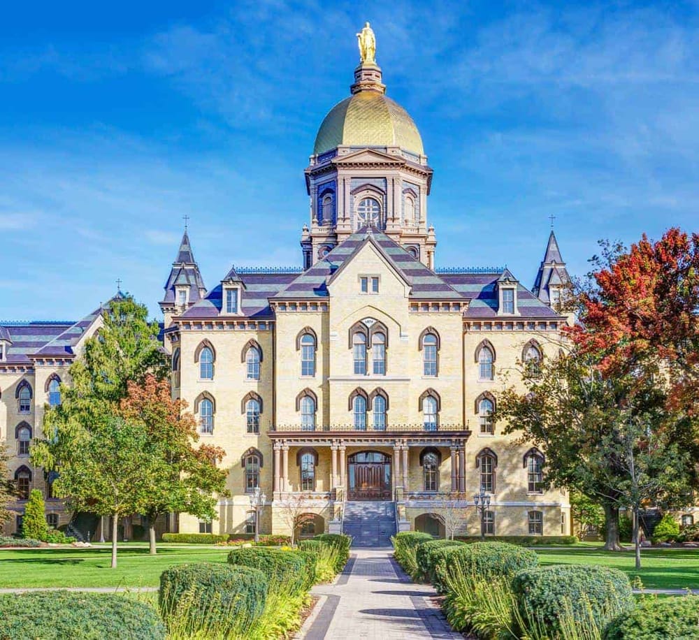Impressive historic courthouse with ornate architecture and lush garden, perfect for local tour guides and attractions.