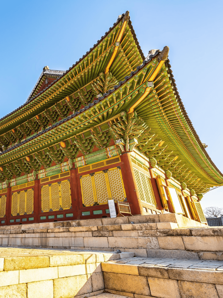 Intricate traditional Asian temple with colorful roofing and detailed woodwork.