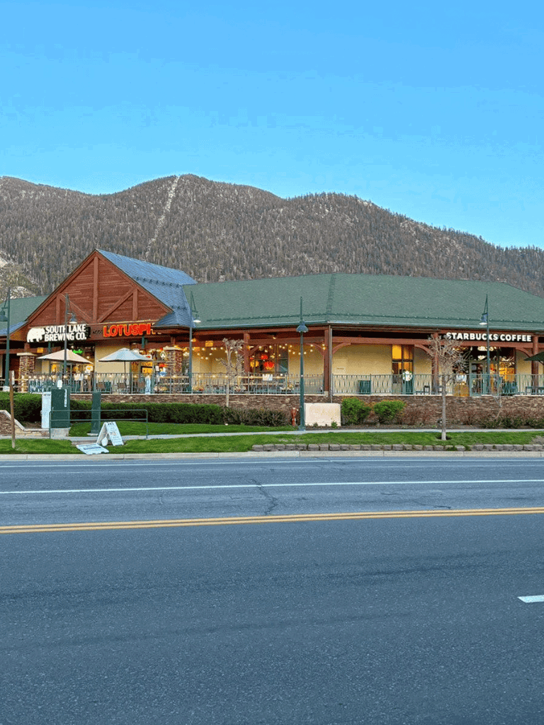 Comfortable mountain-view coffee shop with Starbucks and Lotus Pub in scenic downtown setting.