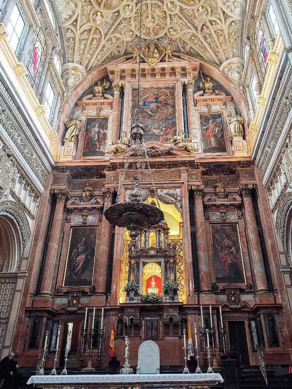 Ornate historic church interior with detailed baroque architecture and religious artwork.