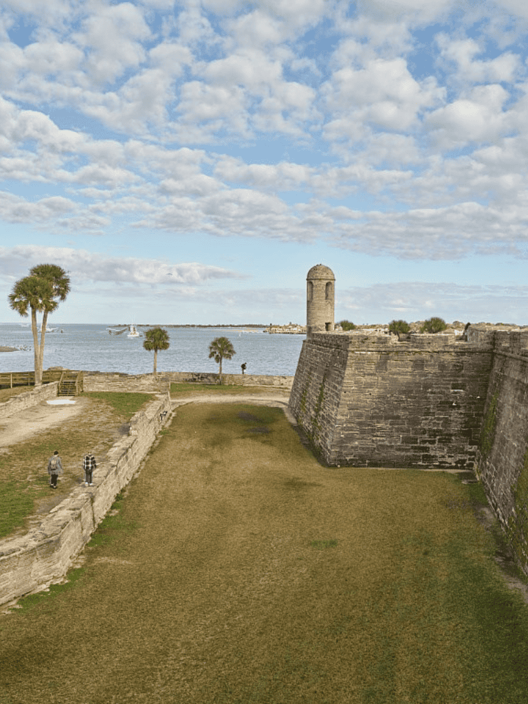 Historic Fort with ocean view and palm trees in St. Augustine, Florida.