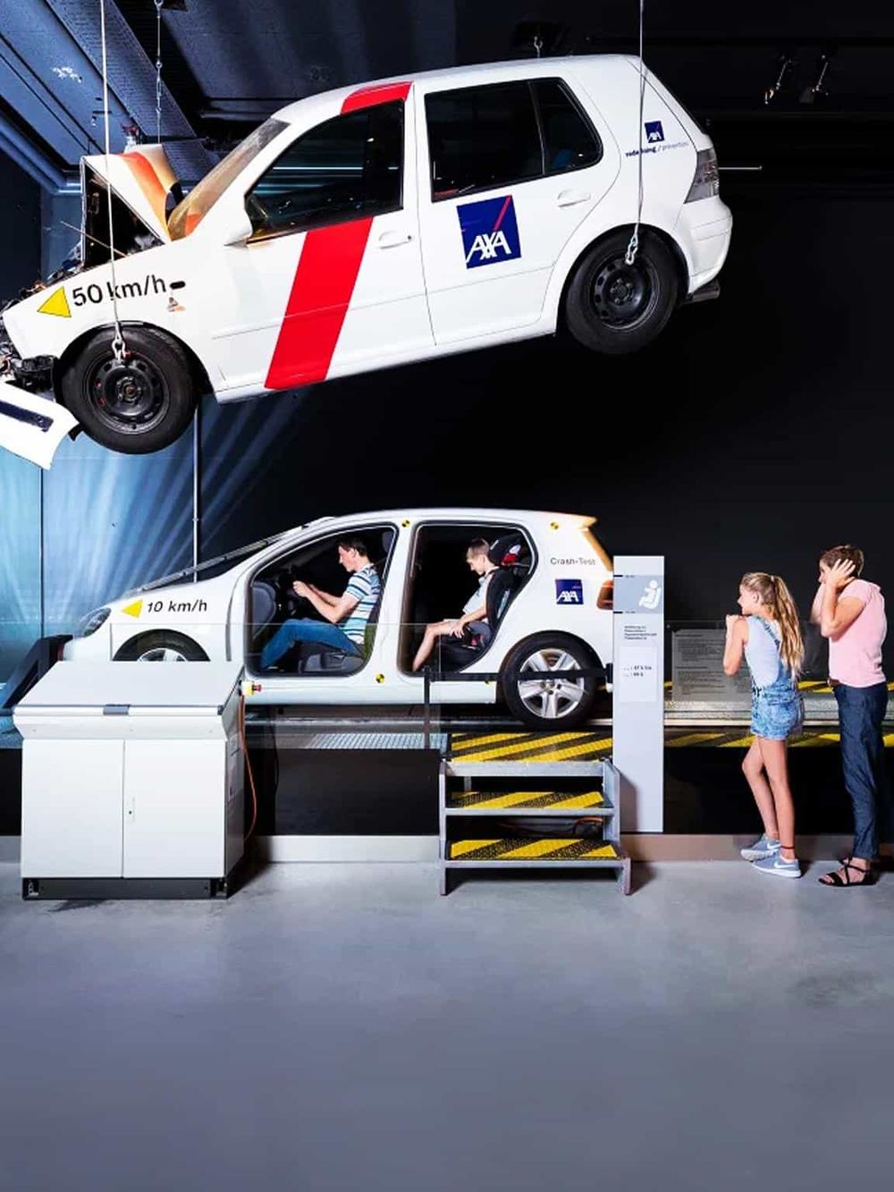 Aviation safety simulation with crash-test vehicle display and interactive driving experience.