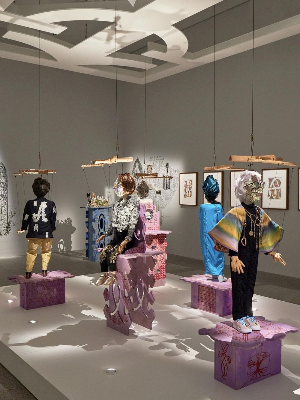 Colorful artistic mannequins at Quest for Directions exhibit, showcasing creative fashion and design.