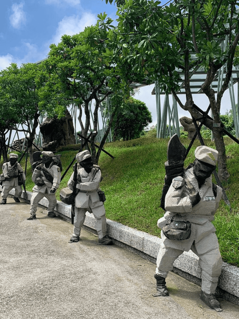 1. Modern military sculpture depicting soldiers with backpacks and weapons.