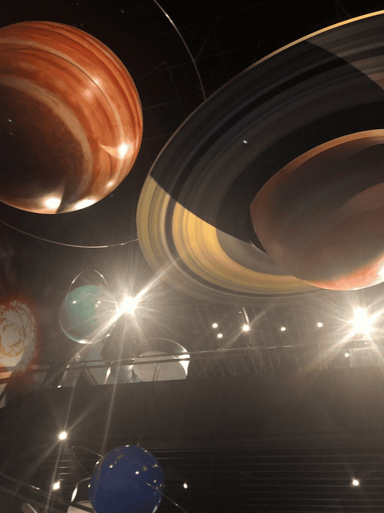 Large planetary models and space exhibit at QuestForDirections planetarium.