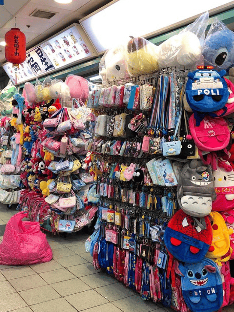 Backpack and plush toy display at QuestForDirections store for kids and teens.