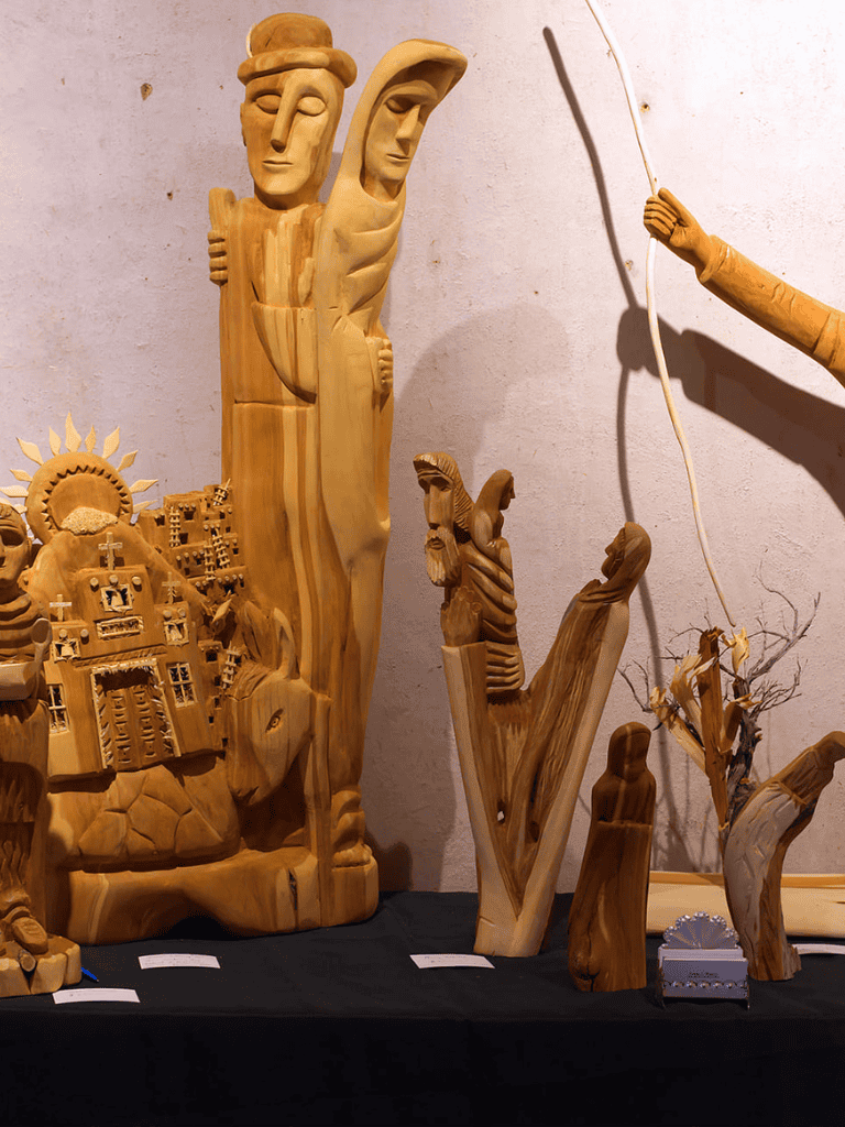 Wooden religious and spiritual sculptures, artisanal carvings with biblical themes, handcrafted nativity scene displays.