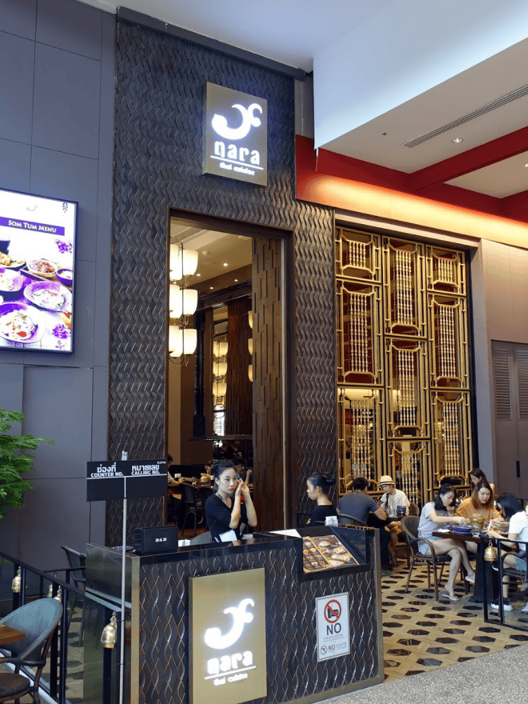 Delicious Asian fusion cuisine restaurant entrance with a welcoming reception area and modern decor at QuestForDirections.