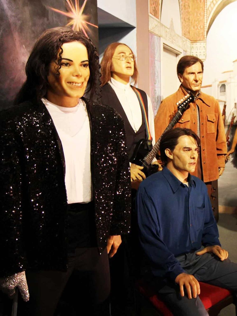 Wax figures of The Beatles at Quest for Directions museum exhibit, showcasing iconic music history artifacts.