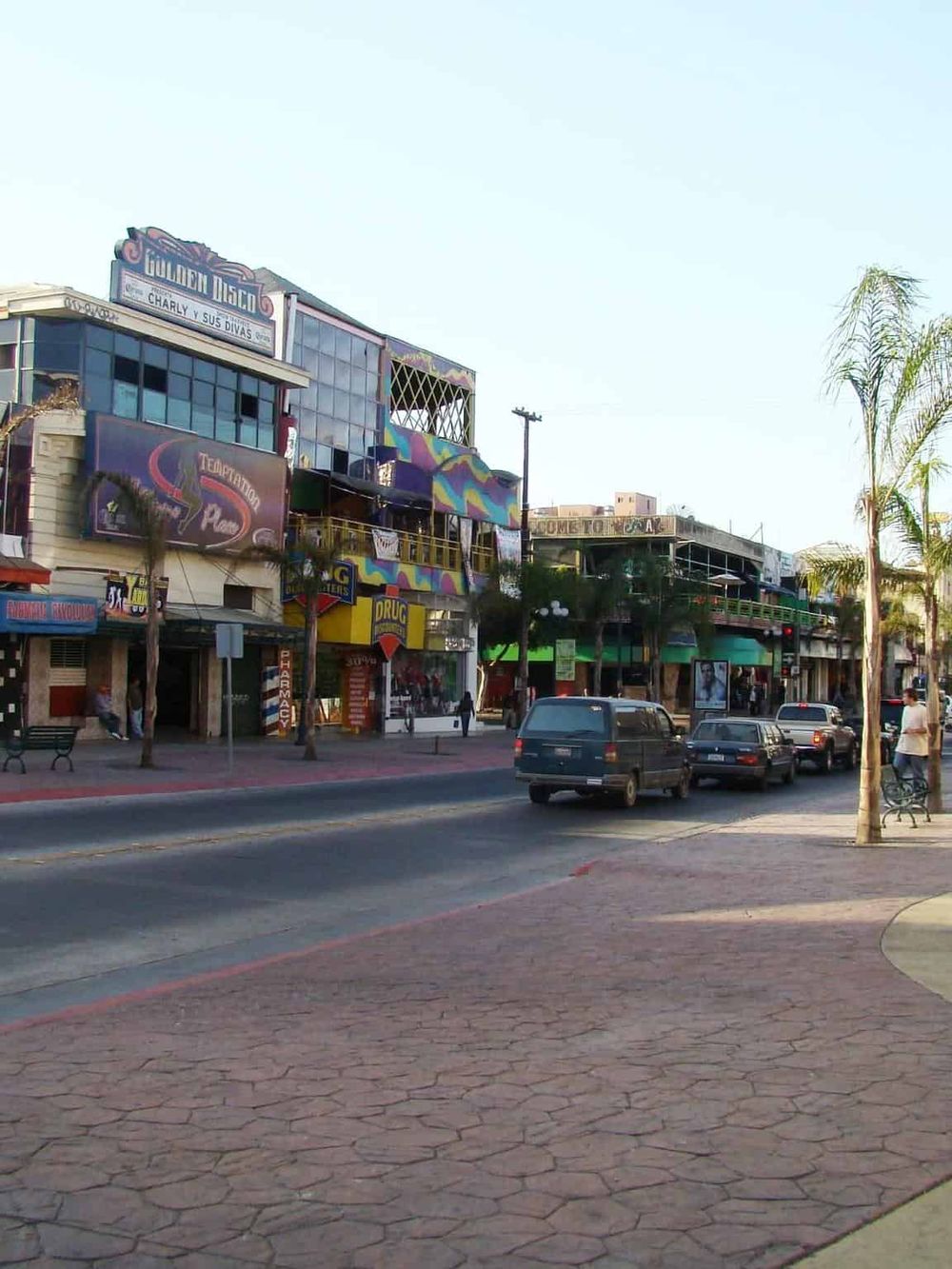 Vibrant street scene featuring eclectic shops, colorful murals, and palm trees, ideal for exploring in Downtown Los Angeles.