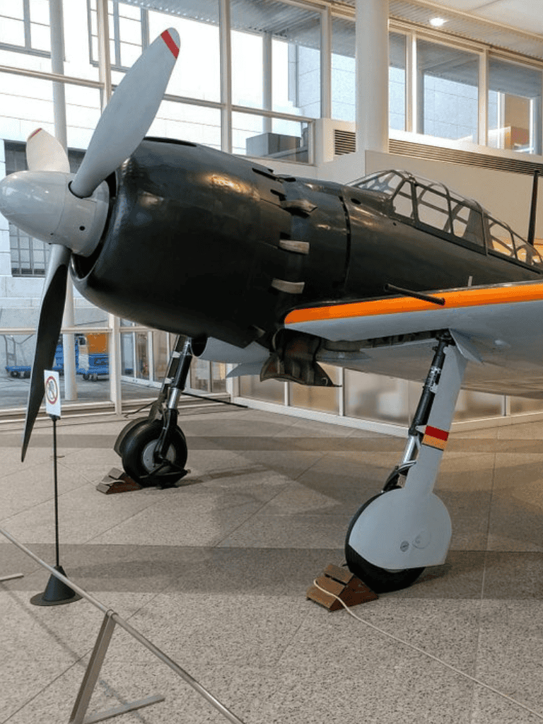1. Vintage aircraft displayed in an airport museum for aviation history enthusiasts.