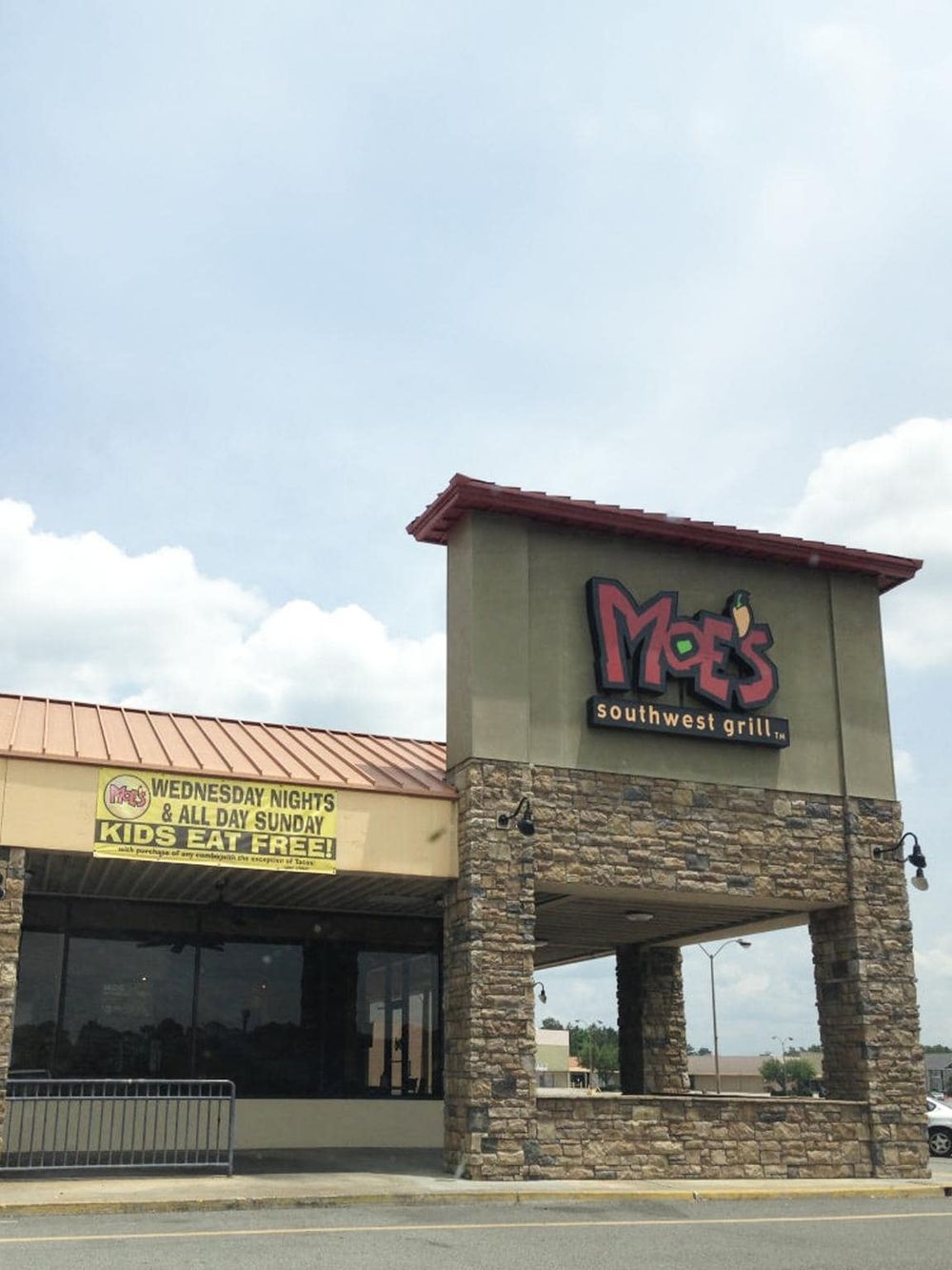Outdoor restaurant building with stone accents and prominent signage for Moe's Southwest Grill.