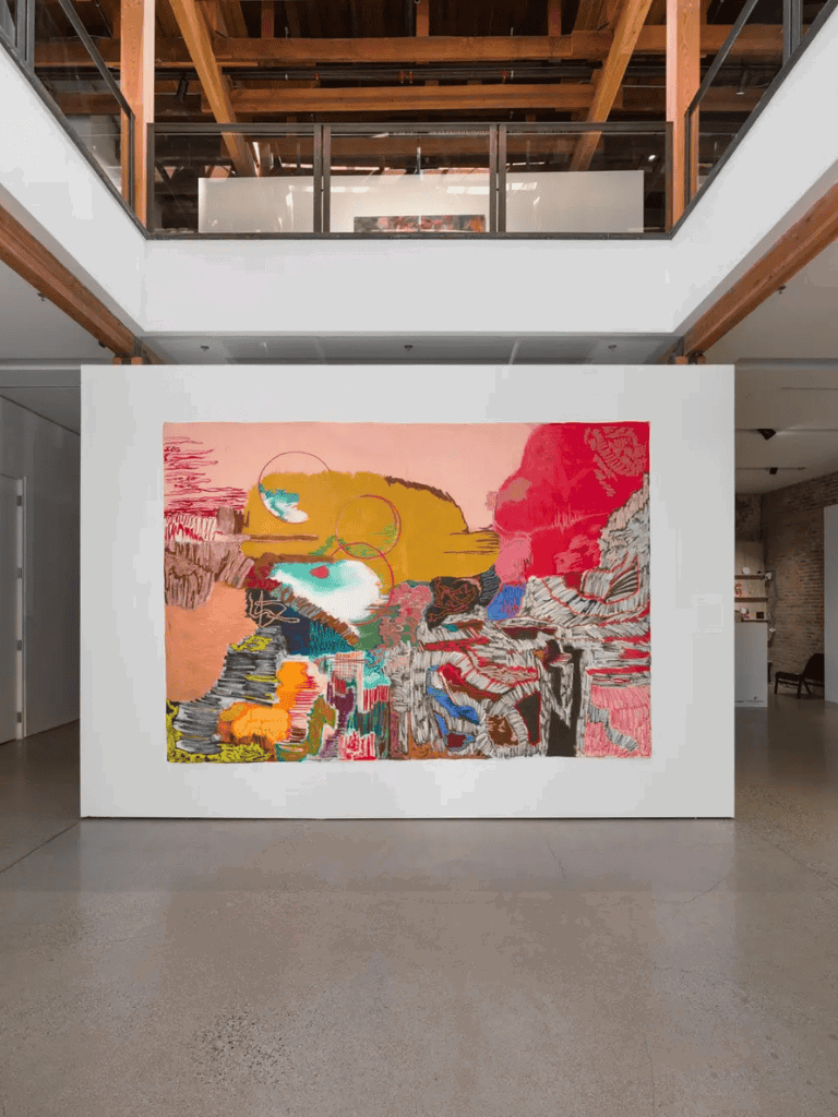 Bright abstract artwork displayed at QuestForDirections art gallery showcasing modern interior design and creative exhibits.