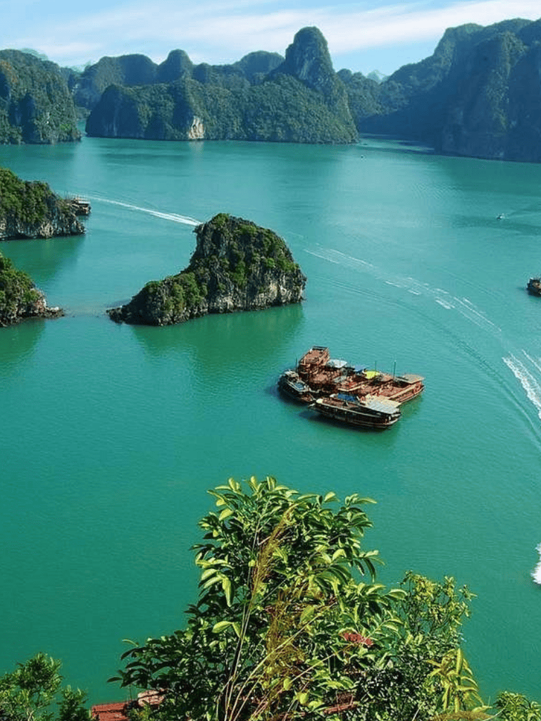 Limestone karsts and emerald waters in Ha Long Bay, Vietnam, scenic maritime landscape.