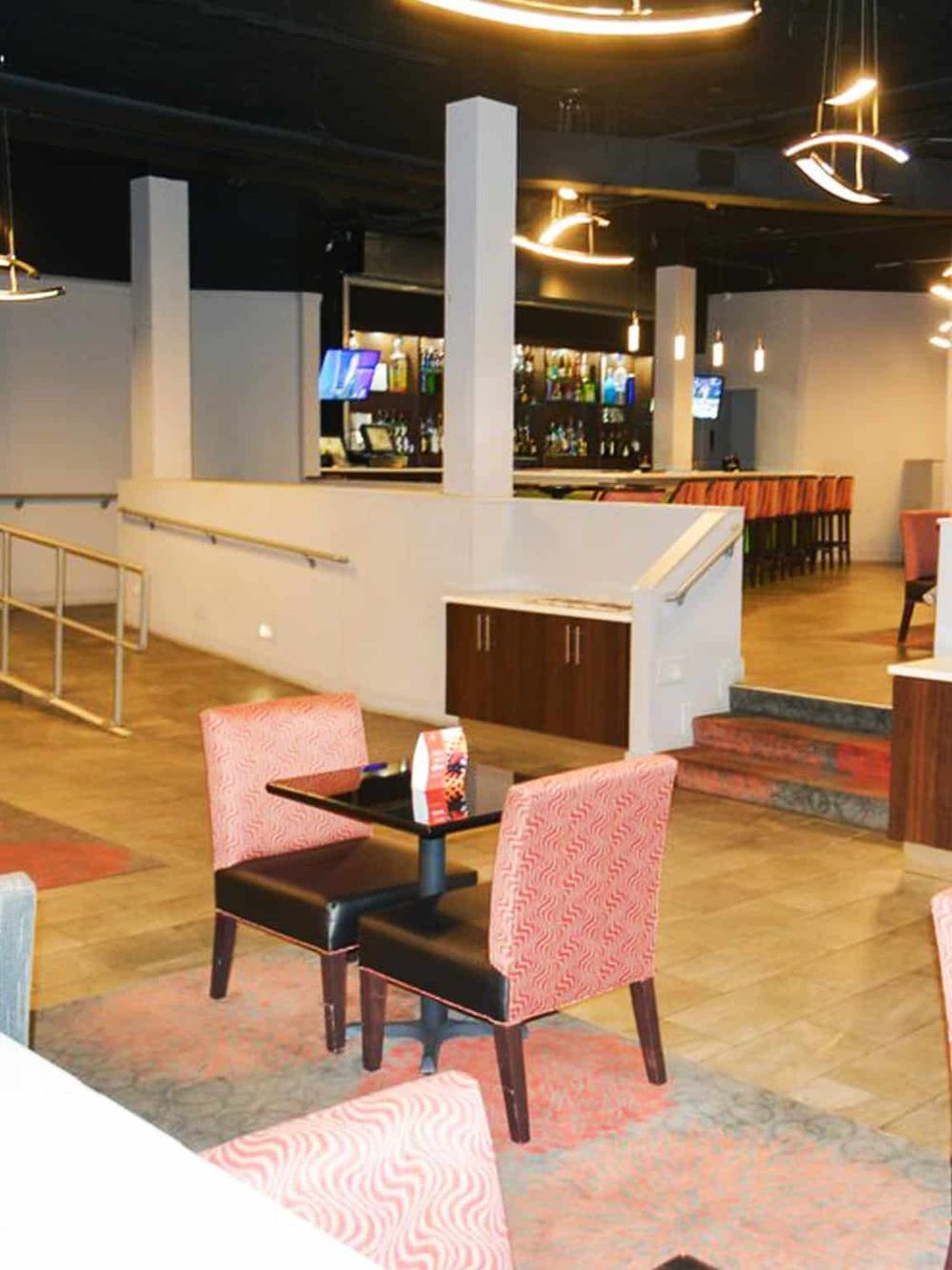 Cozy modern restaurant bar interior at QuestForDirections, featuring stylish seating and inviting ambiance.