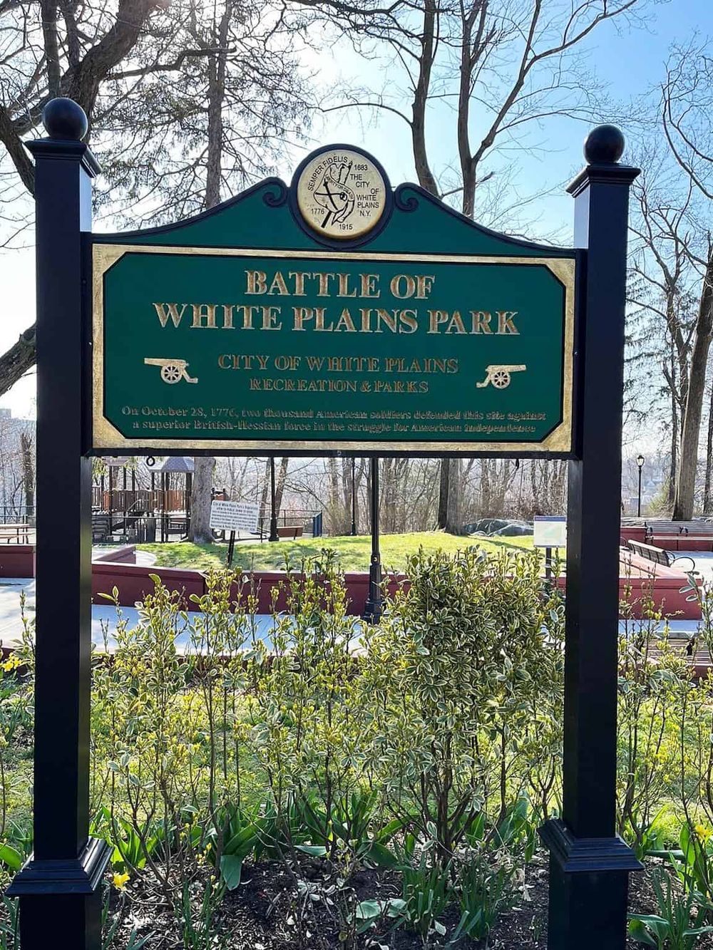 Historic Battle of White Plains Park sign, marking key Revolutionary War site in White Plains, NY.