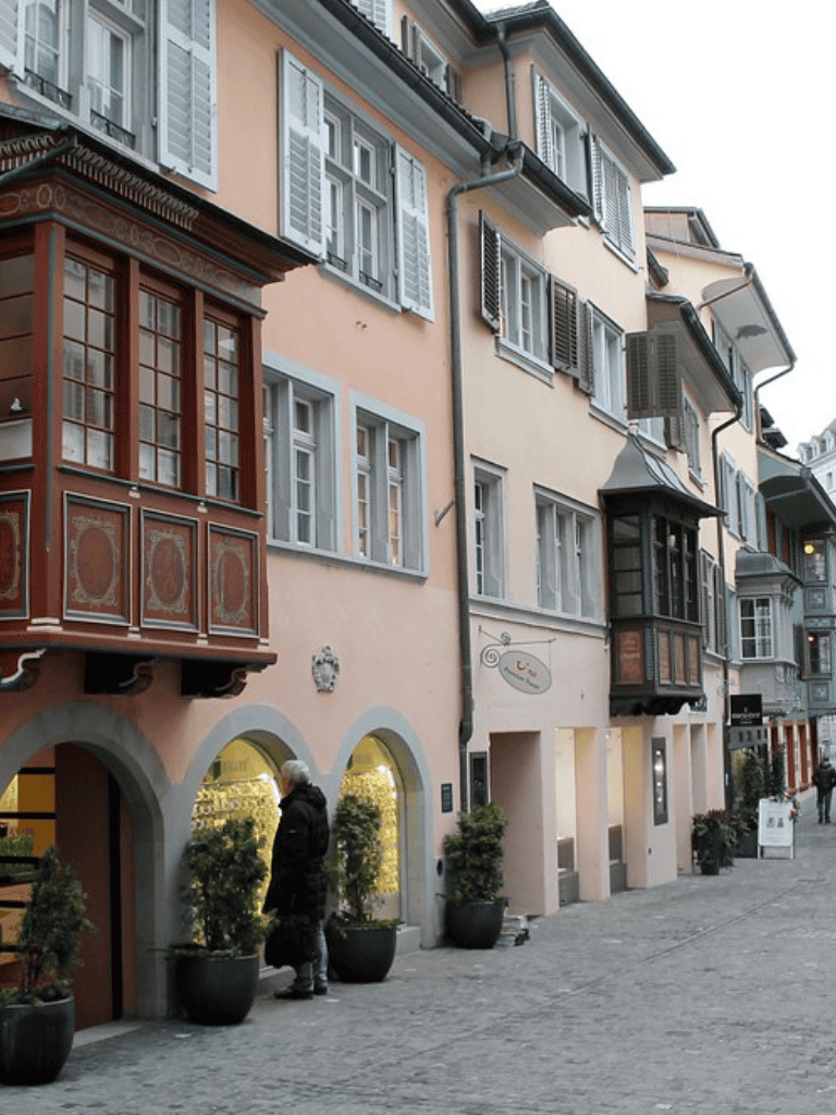 Charming European-style building with colorful facades and traditional wooden balconies.