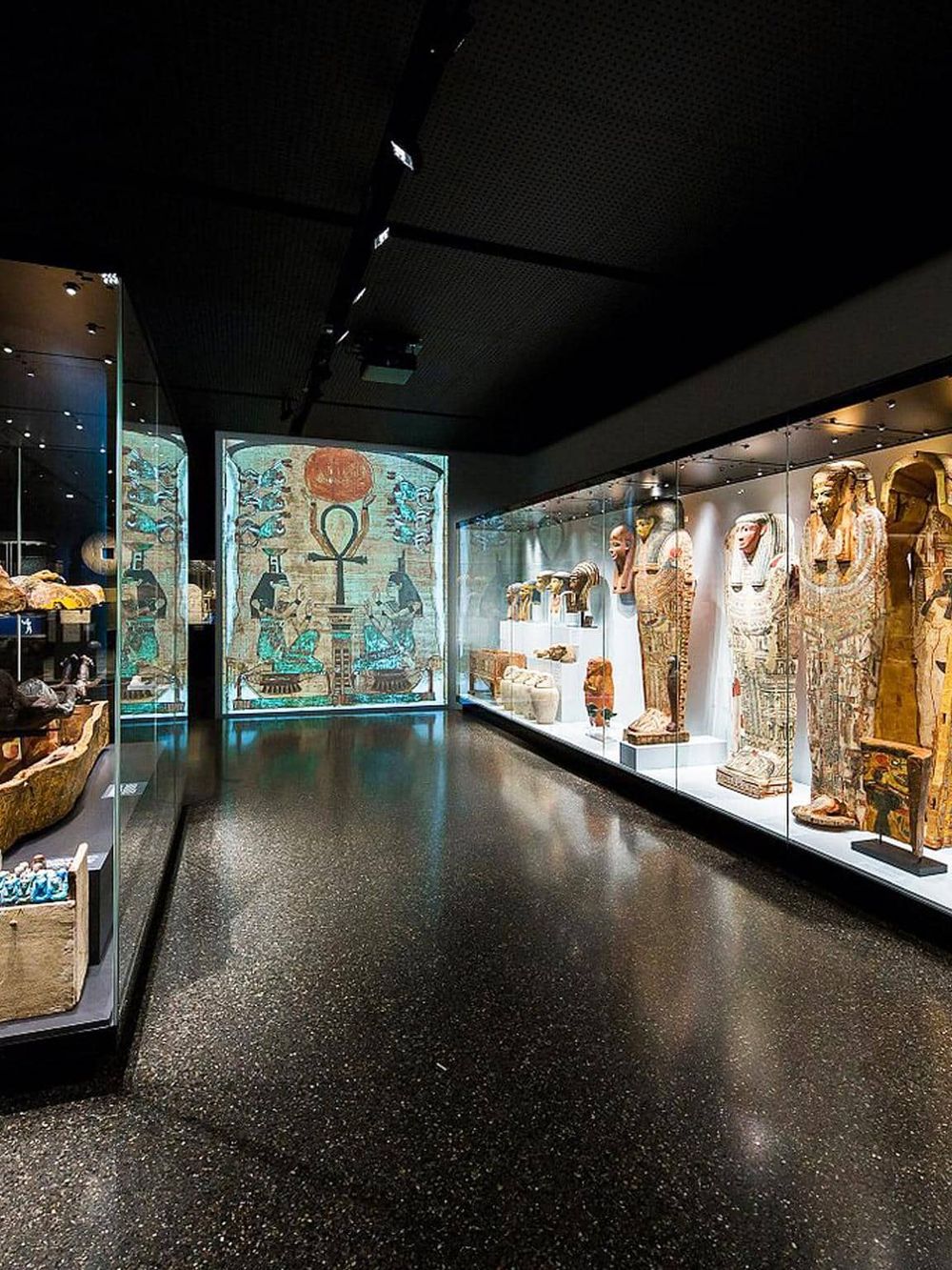 Ancient Egyptian artifacts displayed in a museum exhibit showcasing historical treasures and cultural heritage.
