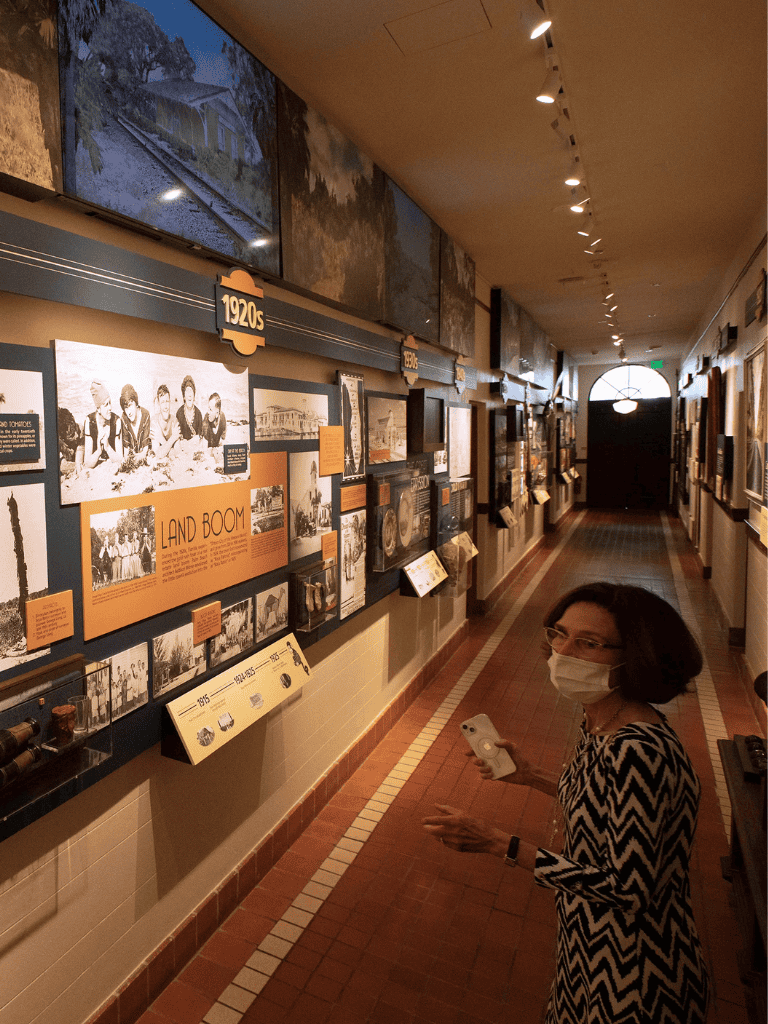 Historic railway exhibit showcasing 1920s train history and land boom photos.