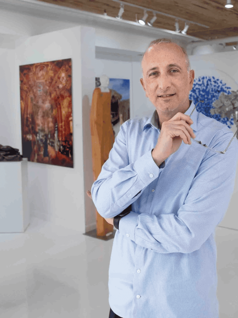 Elegant man in art gallery, enjoying modern paintings, showcasing artistic exploration and cultural appreciation.