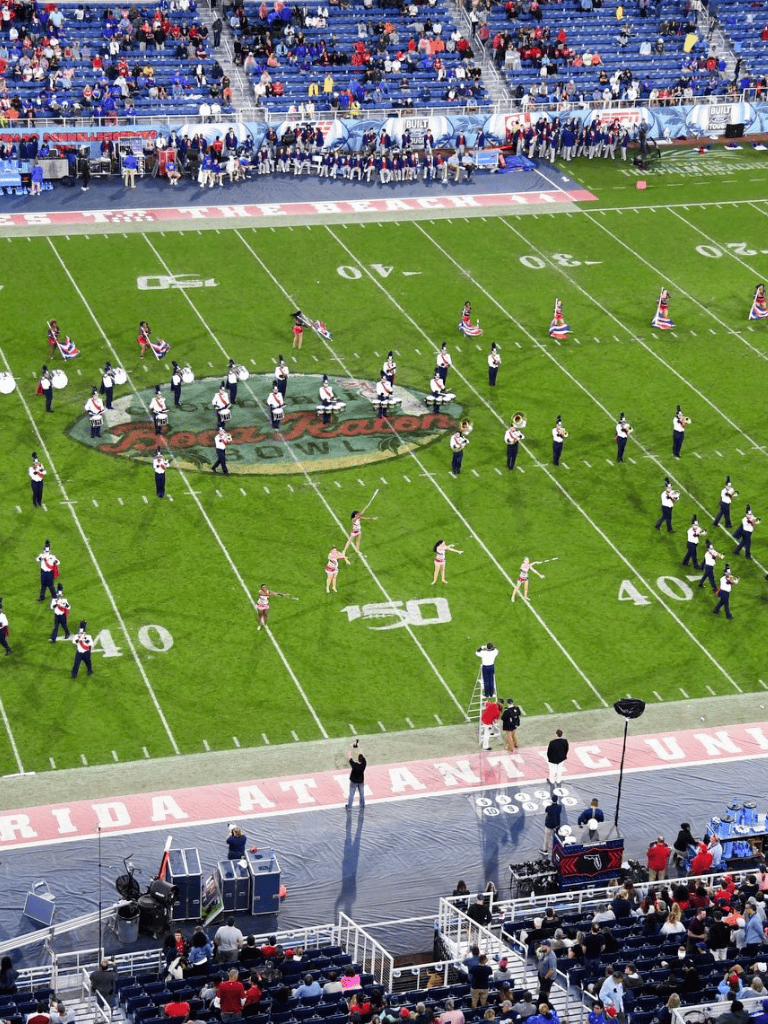 Cheerleading performance at Atlanta Falcons football game, high-energy routines on the field.