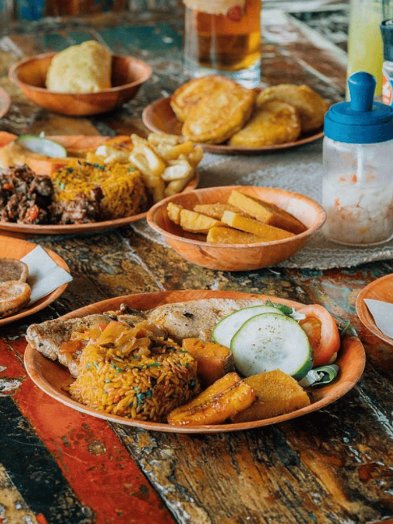 Savory Ethiopian dishes with injera, vegetables, and spices on a rustic wooden table.