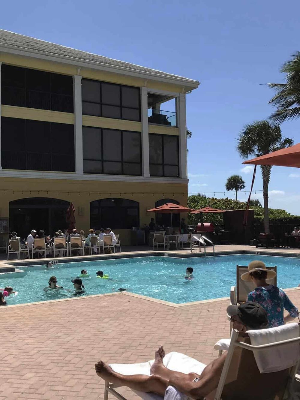 Relaxing poolside scene at Quest For Directions, a premier travel destination in Florida.