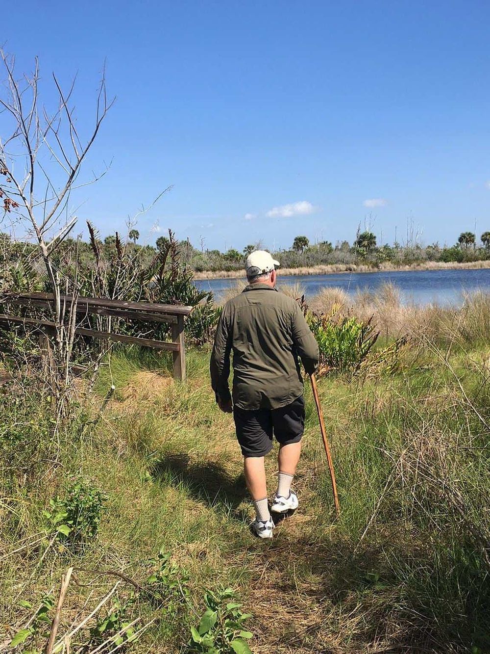 Tranquil nature walk along a lake in Florida, ideal for outdoor exploration and adventure.