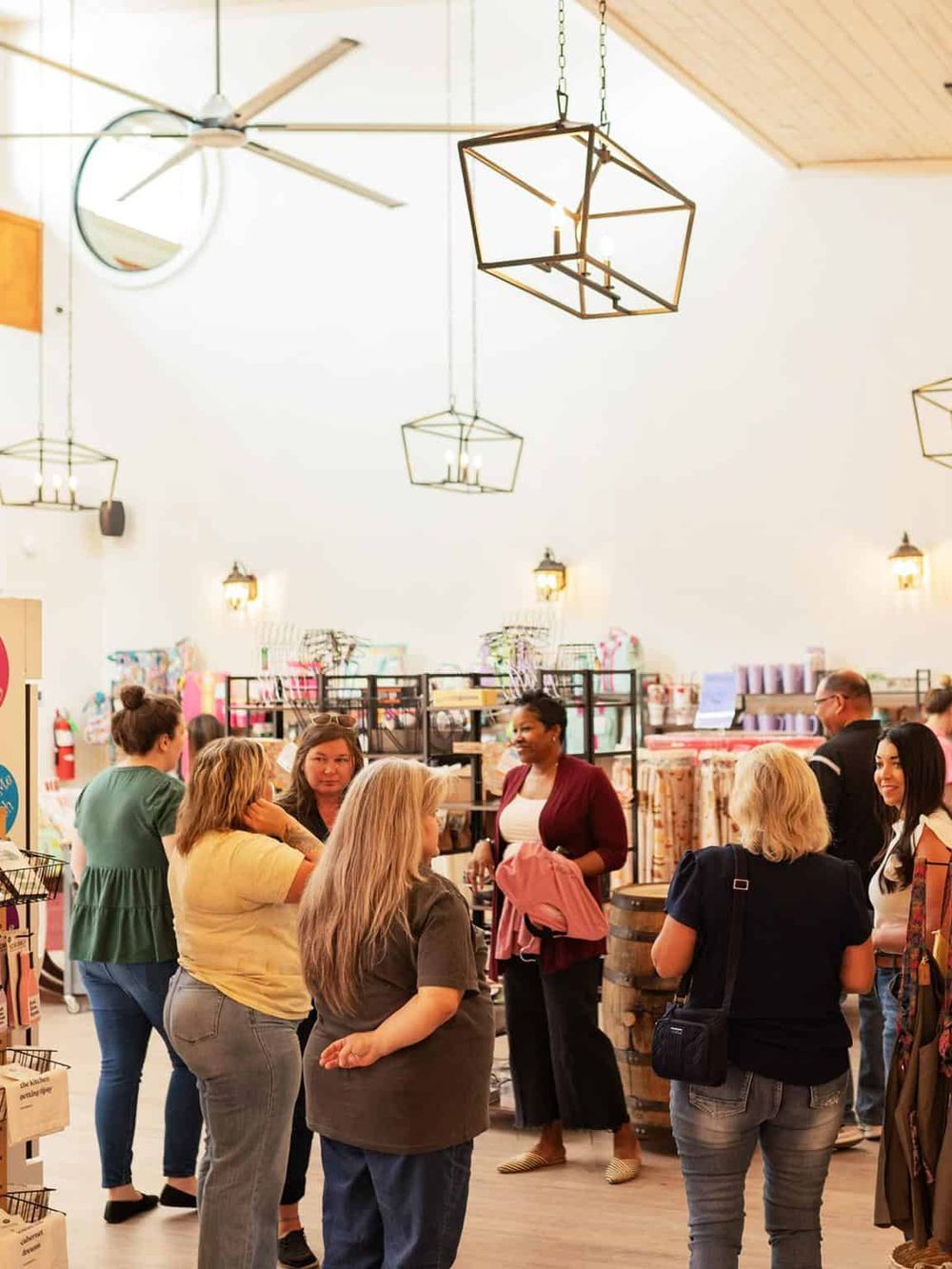 Bright retail store interior with diverse customers shopping and engaging at QuestForDirections.