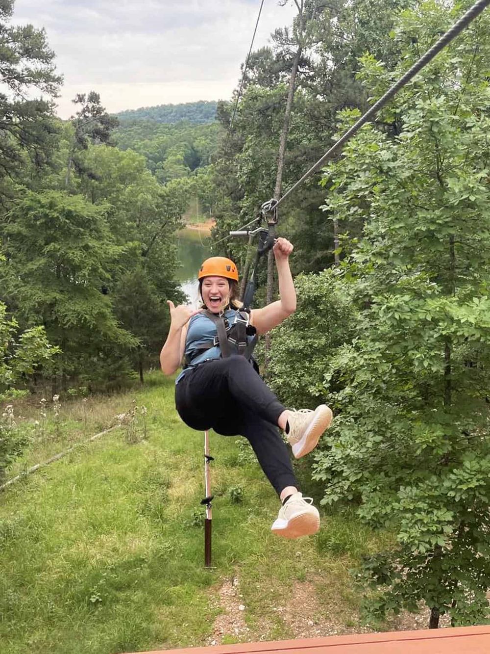 Thrilling zip line adventure amidst lush green forest at QuestForDirections. Experience outdoor fun and adrenaline today.