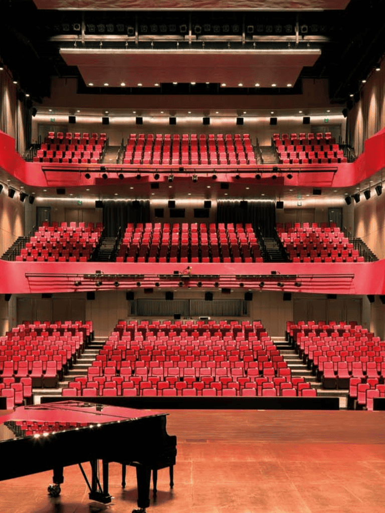 Comfortable theater seating inside a concert hall for performances and events.