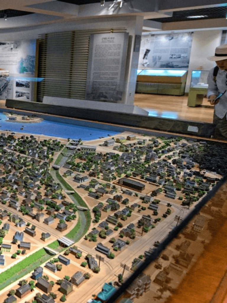 Miniature city model display at QuestForDirections museum exhibit.