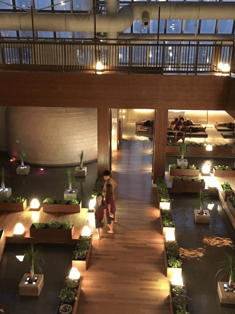 1. Modern indoor lobby with water features and plants at Quest For Directions.