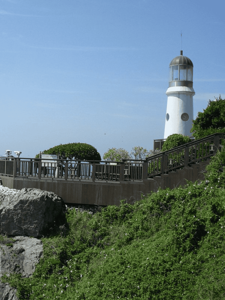 Lighthouse with viewing platform on a bright, clear day in California.