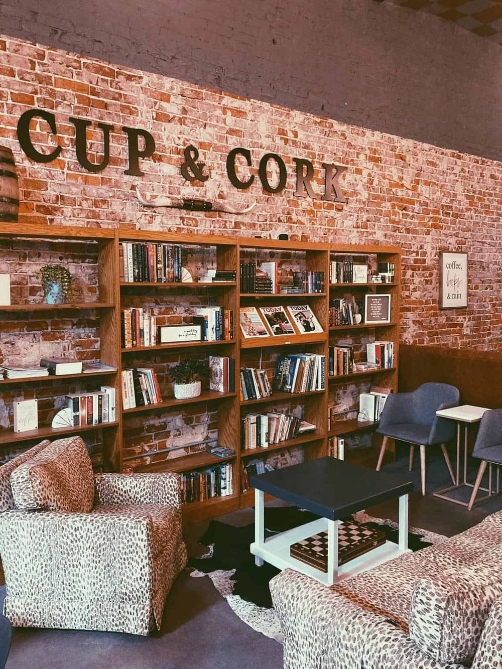 Cozy indoor space with bookshelves and seating, perfect for relaxation or reading at QuestForDirections.