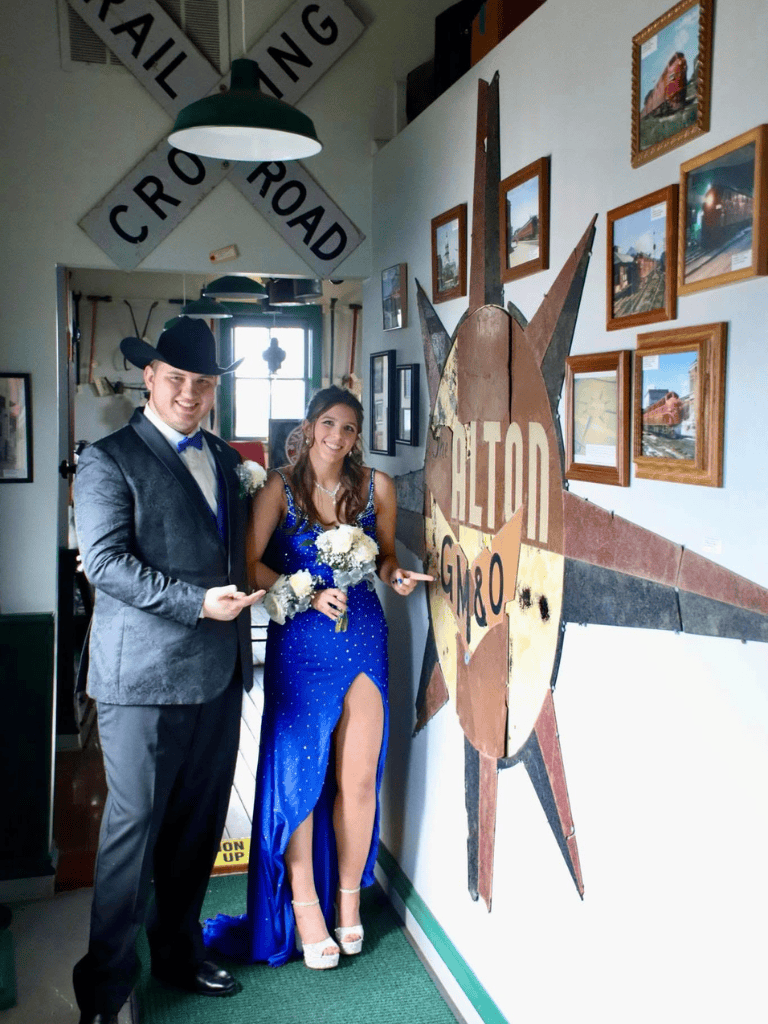 Vintage travel-themed couple at Quest For Directions, a nostalgic roadside attraction.