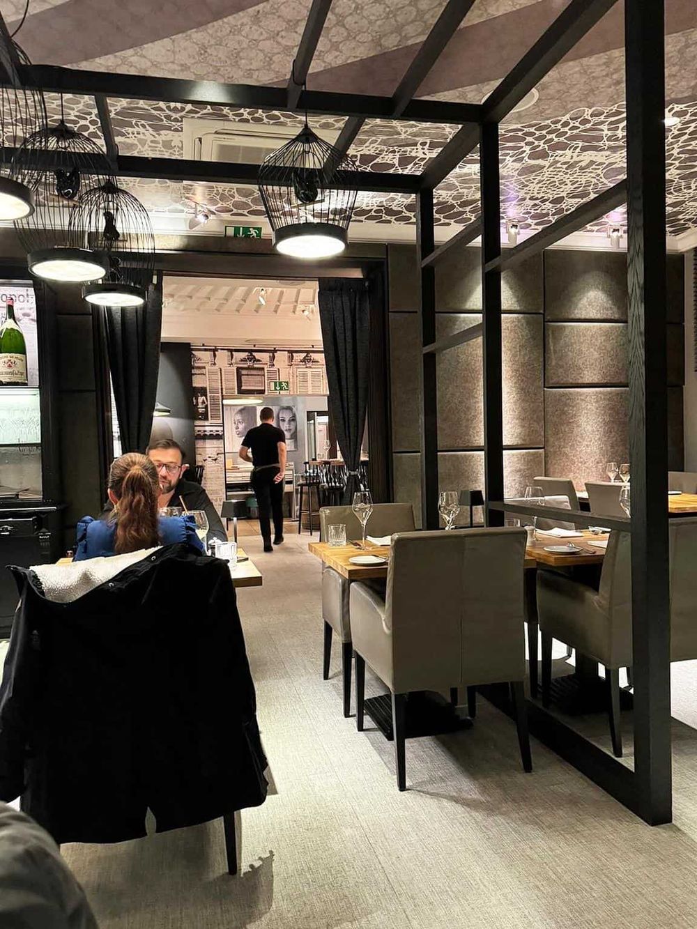 Chic restaurant interior with modern decor, elegant tables, and ambient lighting for fine dining experiences.