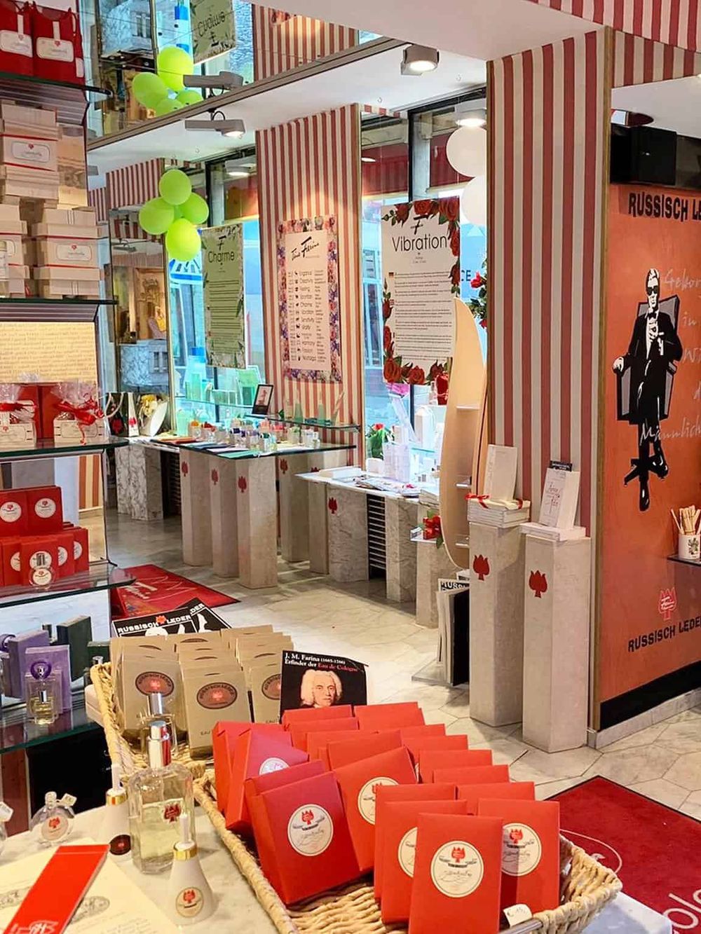 Colorful retail store displaying unique gift items, fragrances, and accessories with vibrant decor and branding.