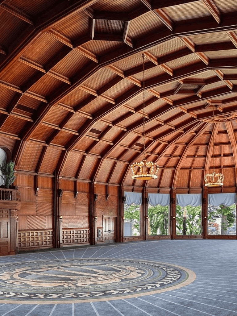 Elegant wooden dome ceiling with chandeliers and large windows at QuestForDirections event space.