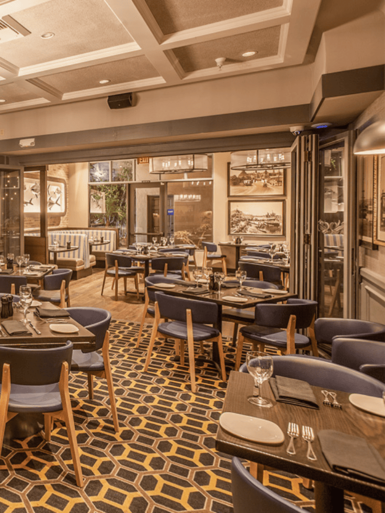 Elegant restaurant interior with stylish decor and seating, perfect for fine dining experiences.