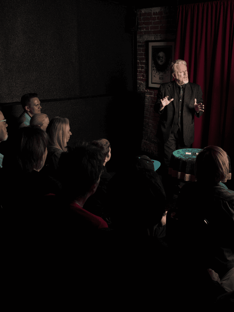 Engaging comedy performance at QuestForDirections event with comedian entertaining an audience.