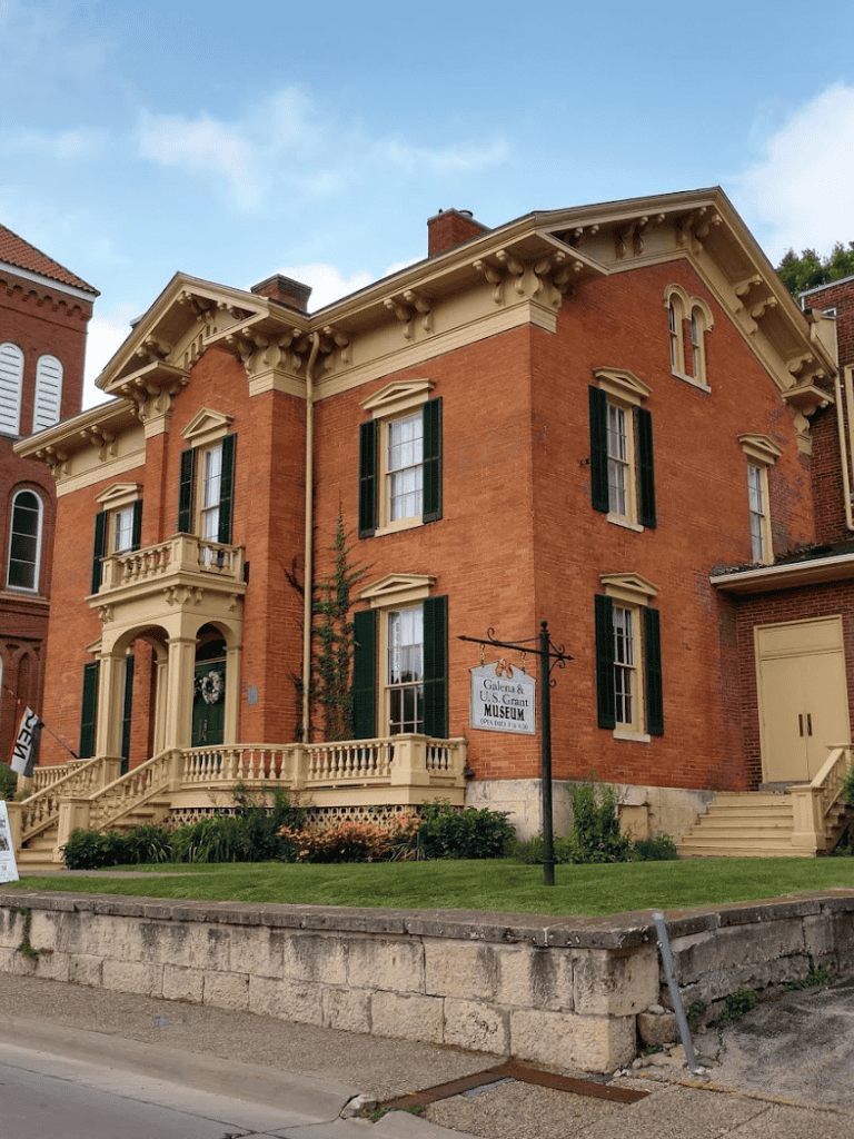 Victorian brick building with green shutters at the Galena & U.S. Grant Museum in Illinois.