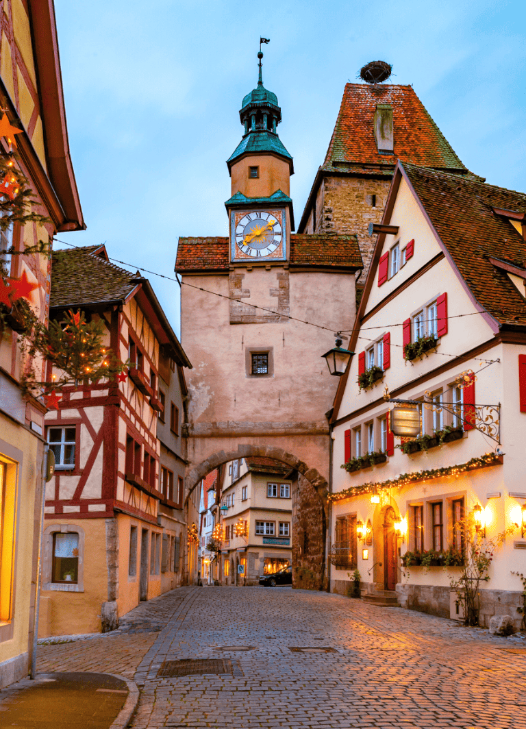 Charming European town with historic clock tower and cobblestone streets, perfect for travel planning.