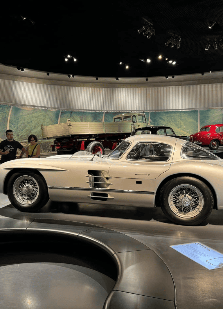 Classic vintage racing car at QuestForDirections auto museum, showcasing historic automobiles.