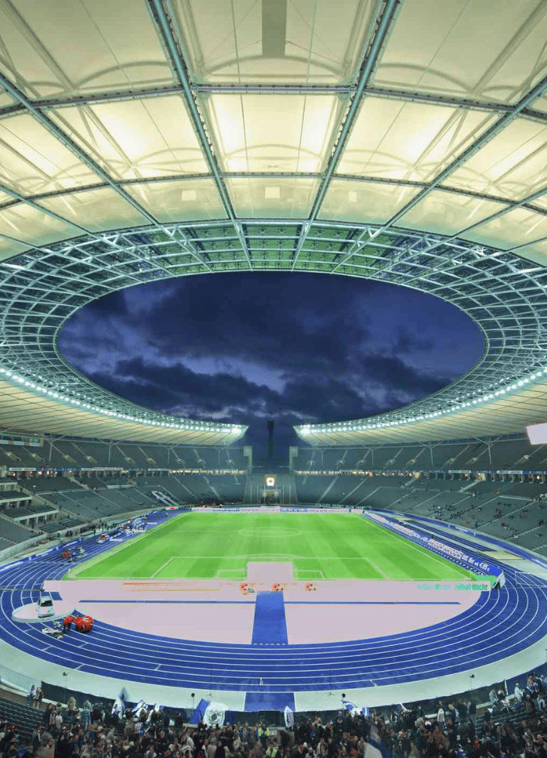 Modern stadium with running track and revolutionizing sports venue experience.