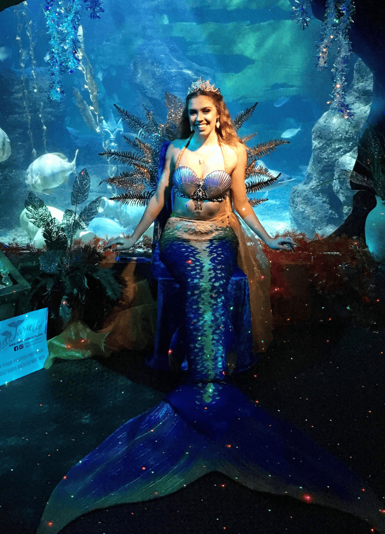Bright mermaid costume at Quest For Directions underwater exhibit, perfect for kids' aquatic adventures.