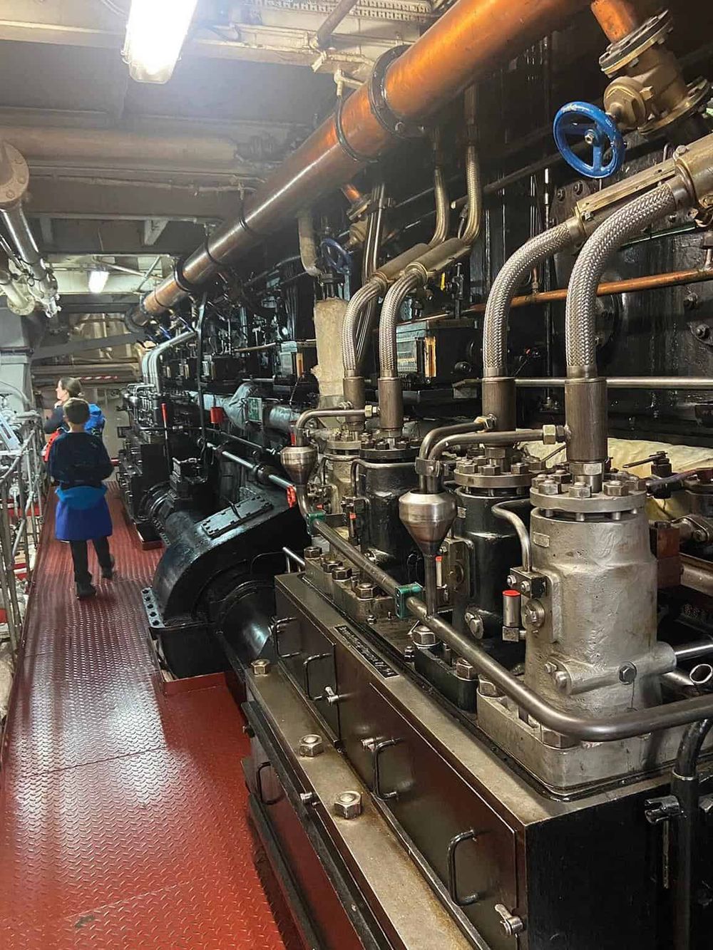 Industrial steam engine machinery with pipes and valves at QuestForDirections.