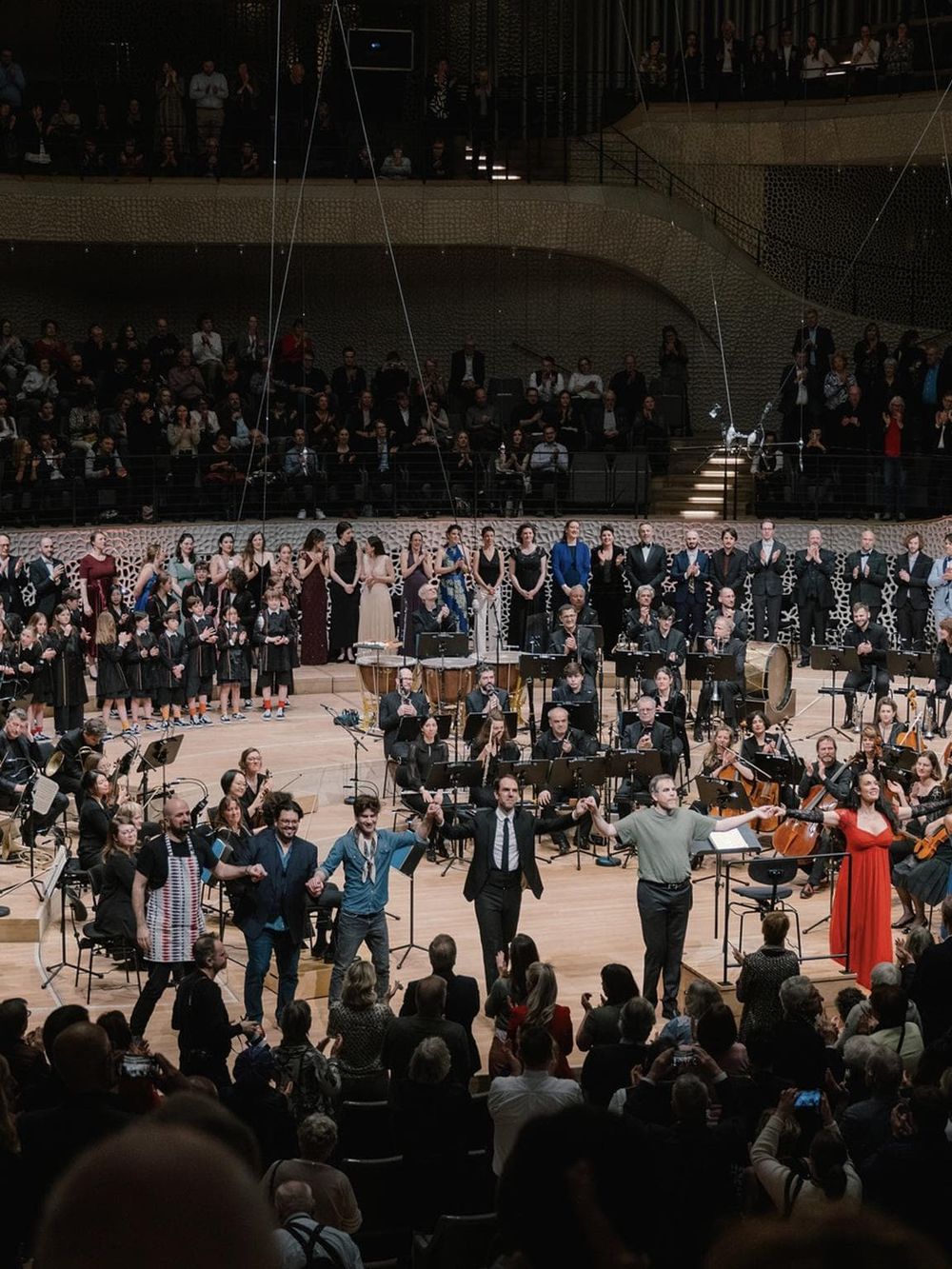 Festive orchestra performance at QuestForDirections event, showcasing musical talent and community celebration.