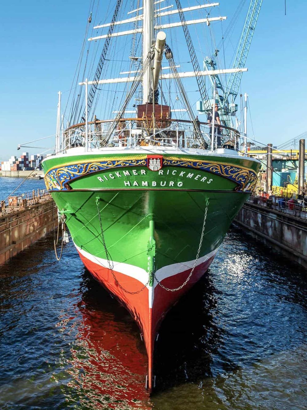 Colorful historic sailing ship docked at Hamburg harbor for boat tours and maritime exploration.
